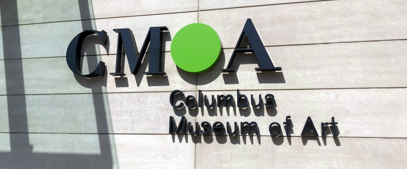 Signage on front wall of museum that reads, "CMOA - Columbus Museum of Art"