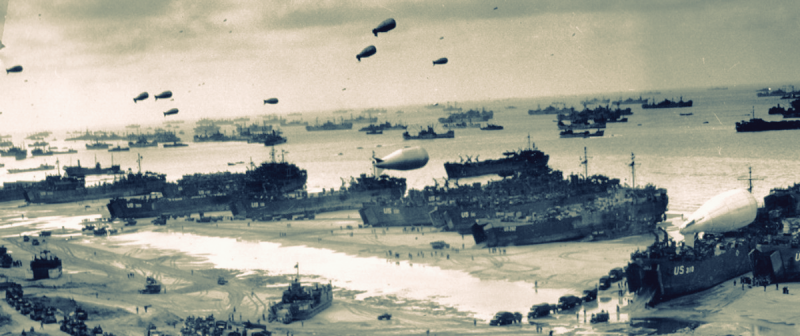 Photo of American and allied troup ships landing on the beach at Normandy on June 6, 1944