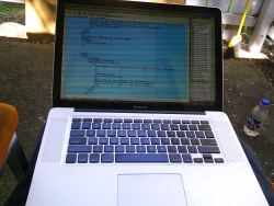 The MacbookPro with the HTML software and the HTML page for this blog on the screen