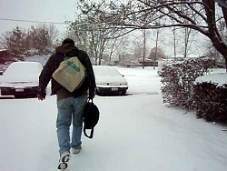 K.L.Storer, walking to his car, in the new winter snow.