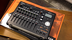 My TASCAM DP-03 sitting ontop of its product box, on a library shelving truck at work
