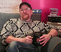 K.L. on couch looking at camera